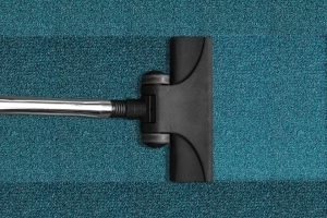 close up image of vacuum on a carpet. We provide commercial carpet cleaning in Seacoast NH