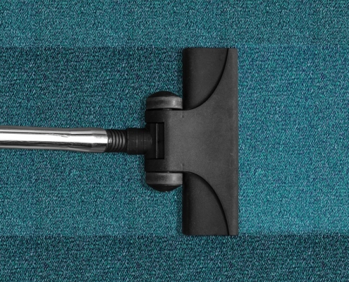 close up image of vacuum on a carpet. We provide commercial carpet cleaning in Seacoast NH